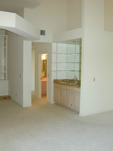 Looking from living roon to wet bar area.