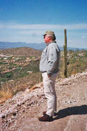 King of all he surveys!  By the way, this picture was taken one hour after Mike's FIRST golf lesson...another sad story.....
